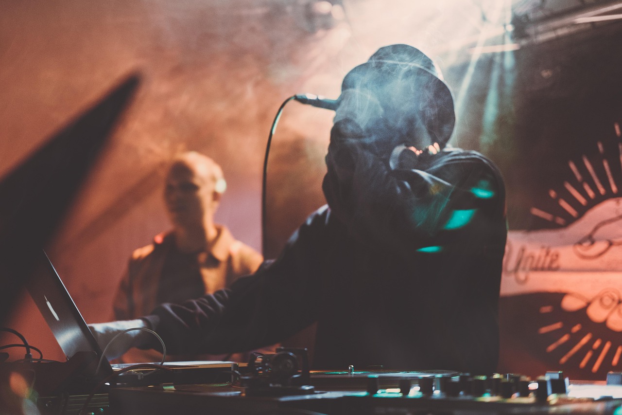 Concert, dj, festival, laptop, leather jacket, light rays, men, microphone, musician, people, performance, singer, smoke, stage, stage lights, live performance, concert, concert, concert, concert, festival, festival, festival, festival, men, microphone, microphone, musician, musician, singer, singer