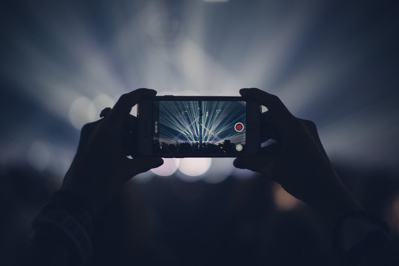Iphone, concert, lights, stage lights, record, video, recording, video recording, capture, apple product, hands, audience, event, live event, live performance, dark, party, smartphone, crowd, video, video, video, video, video